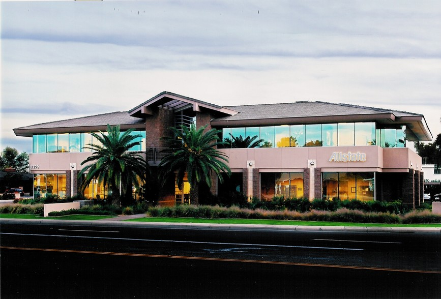 The HR Wise Office building with two palm trees standing outside of the front door. Surrounding the building is beautiful landscaping and grass.